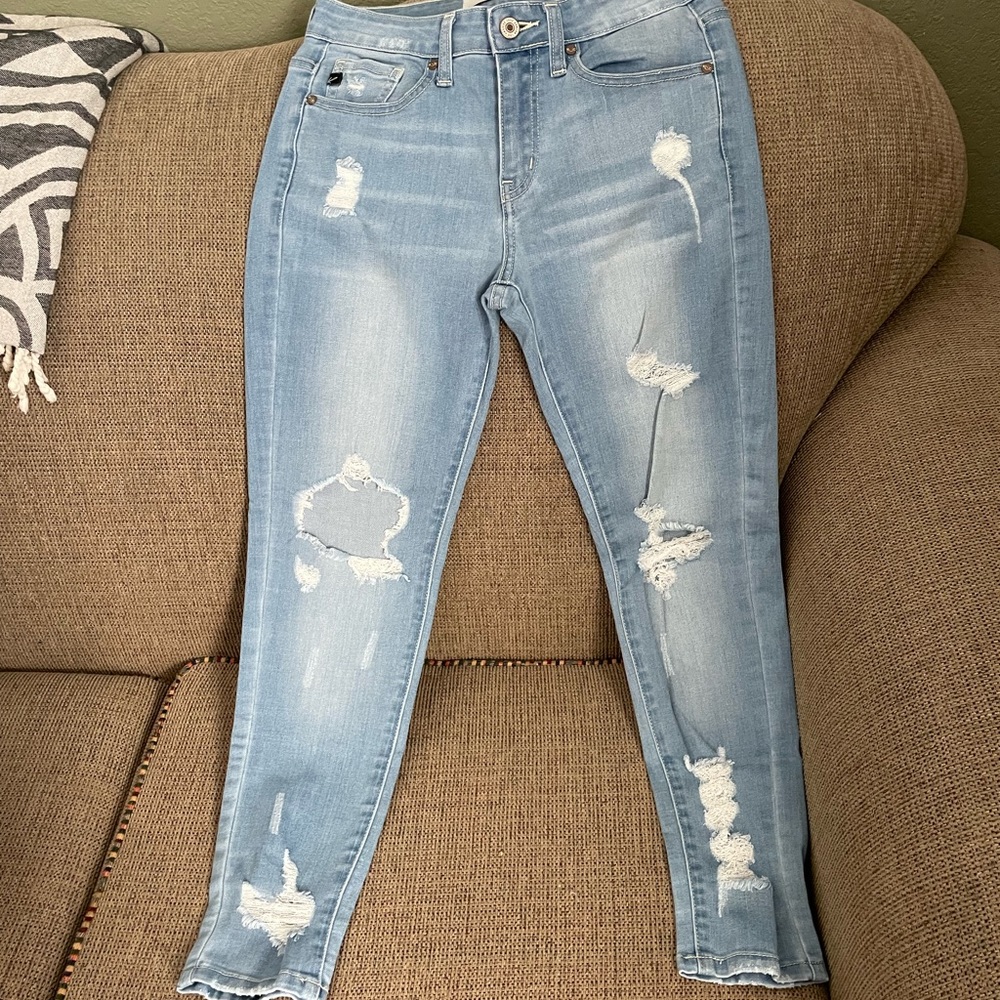 KanCan distressed light blue jean jeggings.